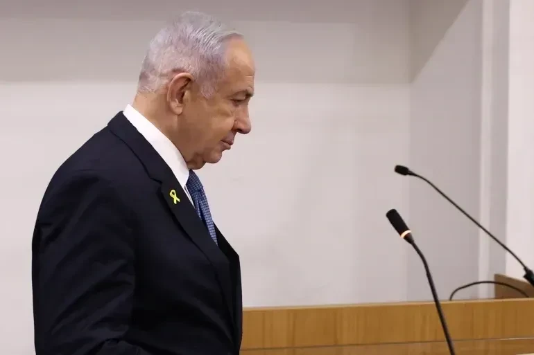 Elderly man speaking at podium microphone